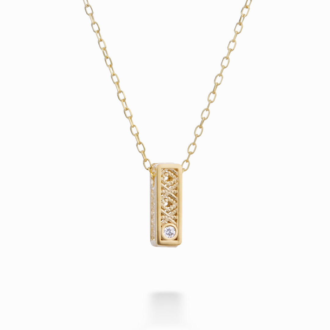 Nihama cl 18k bogstav i gult guld diam. ct.0,01 NDLETHIUM1