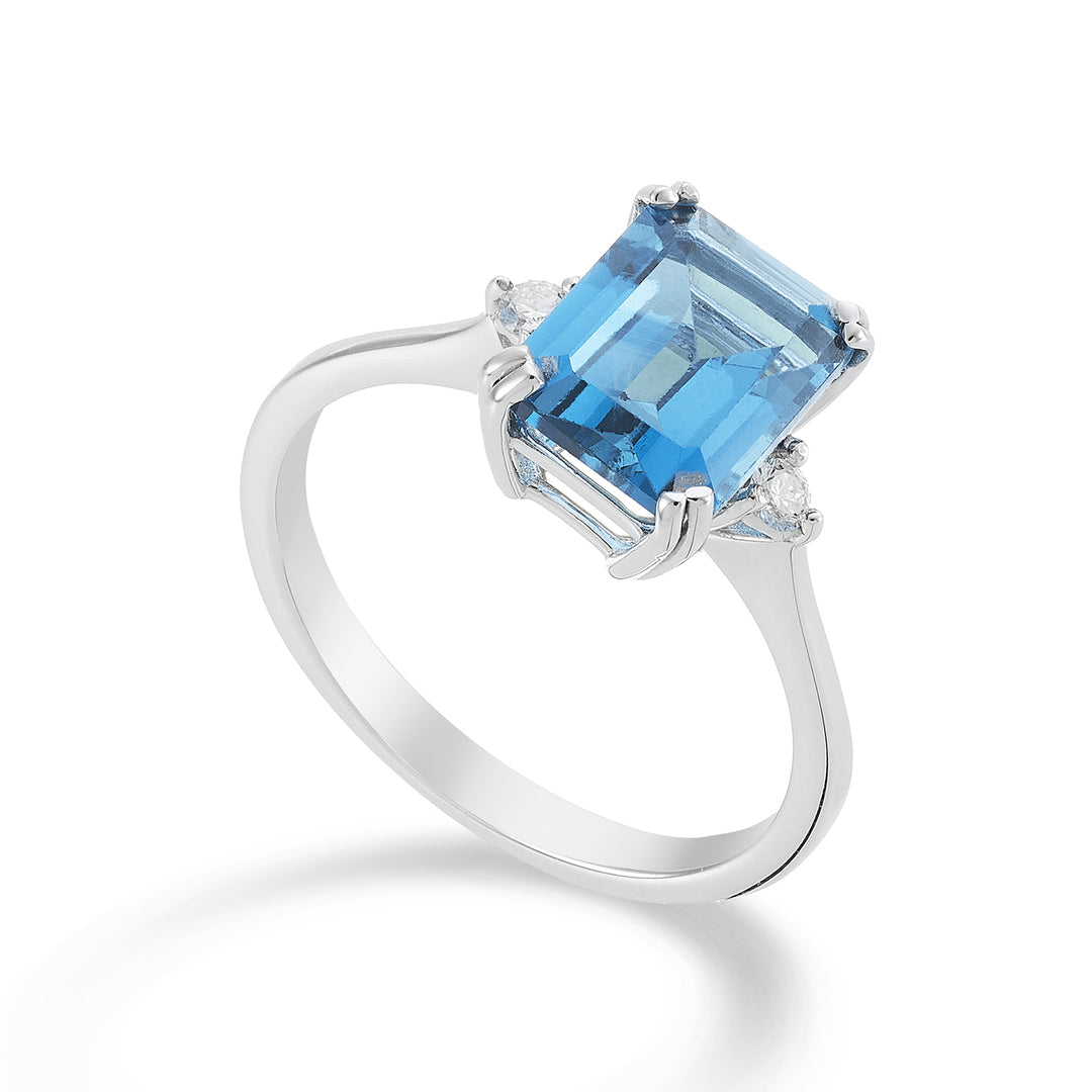 Mikiko une topaze bleue octogonale 18 carats 7x9 ct.2,90 diam. ct.0,08 MACL090DITPAZ4O4