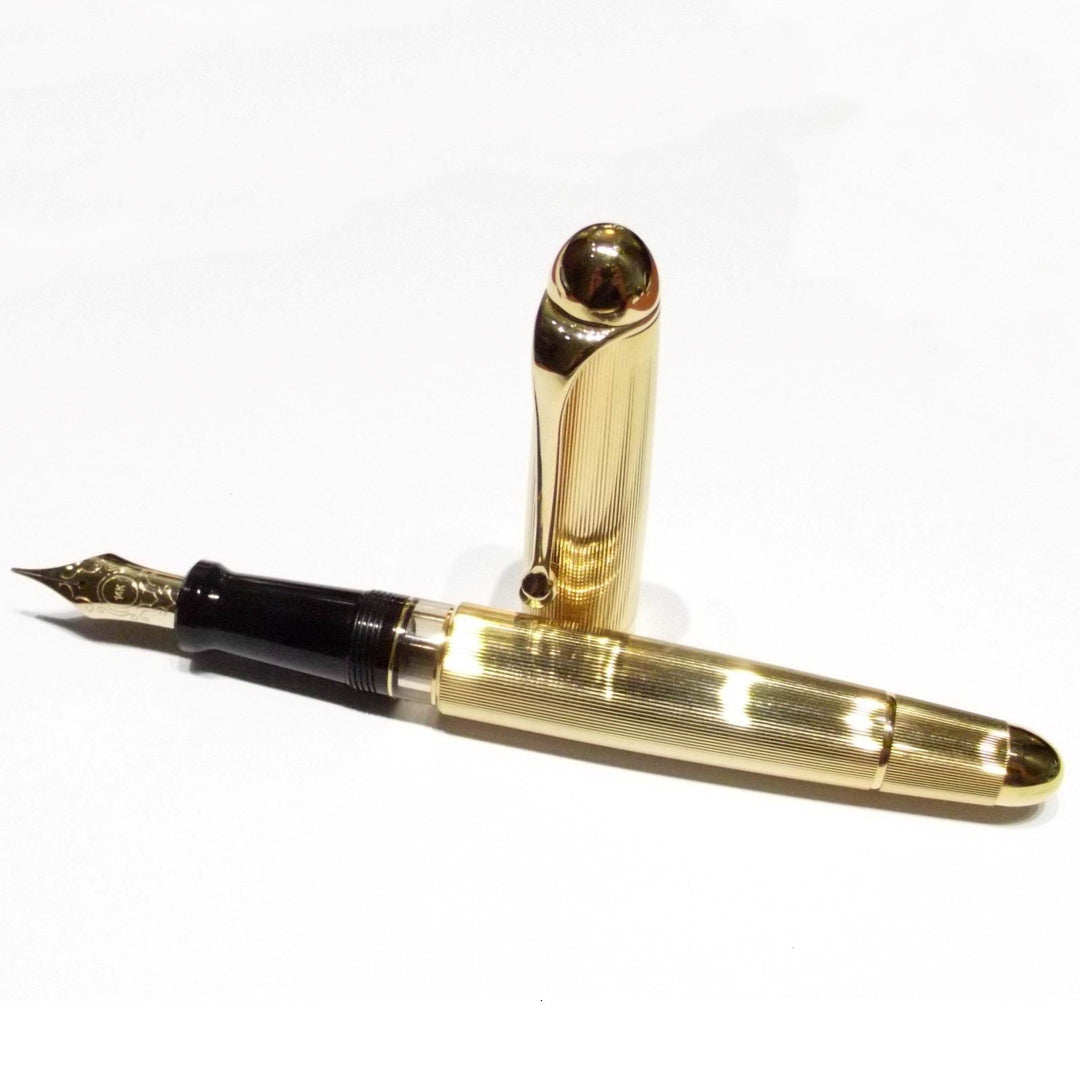 Caneta-tinteiro Aurora pistão 802 laminado dourado - Gioielleria Capodagli